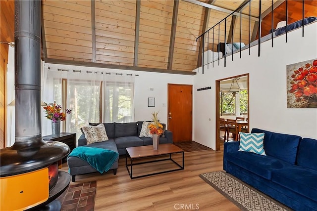 31867 Wagon Wheel Dr, Running Springs, CA 92382 - living area with a high ceiling, wood finished floors, and a wood stove