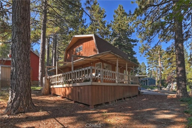 31867 Wagon Wheel Dr, Running Springs, CA 92382 - rear view of property with roof with shingles and a gambrel roof