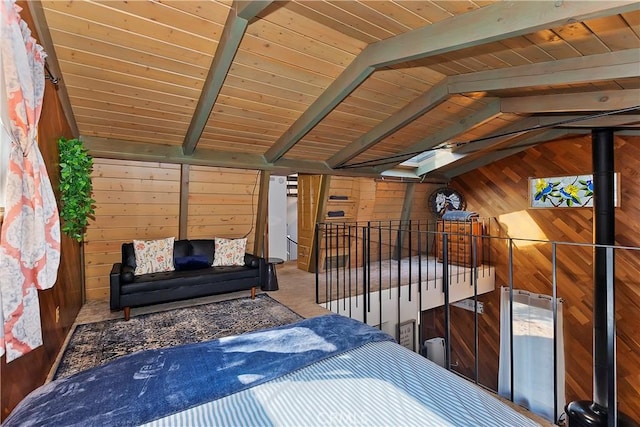 unfurnished bedroom featuring wood walls, carpet flooring, wood ceiling, and vaulted ceiling with beams