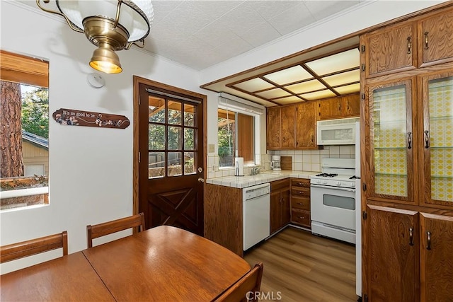 31867 Wagon Wheel Dr, Running Springs, CA 92382 - kitchen featuring white appliances, dark wood-type flooring, brown cabinets, backsplash, and tile countertops
