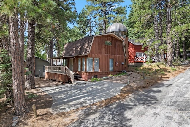 31867 Wagon Wheel Dr, Running Springs, CA 92382 - view of front of property featuring a gambrel roof and concrete driveway