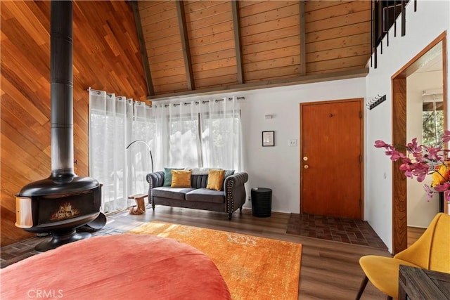 31867 Wagon Wheel Dr, Running Springs, CA 92382 - living room with a wood stove, high vaulted ceiling, wood finished floors, and a wooden ceiling with exposed beams