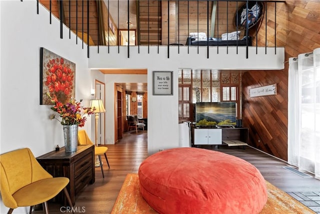 31867 Wagon Wheel Dr, Running Springs, CA 92382 - living room featuring a towering ceiling, wood finished floors, and wood walls