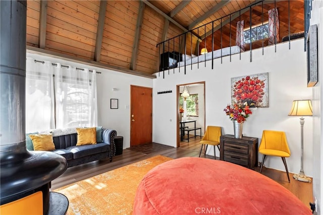 31867 Wagon Wheel Dr, Running Springs, CA 92382 - living area with high vaulted ceiling, a wooden ceiling with exposed beams, healthy amount of natural light, and wood finished floors