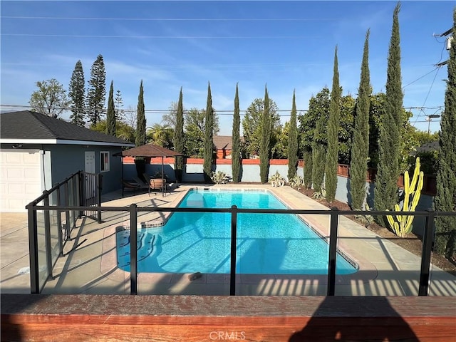 view of pool featuring a fenced in pool, a patio area, and fence
