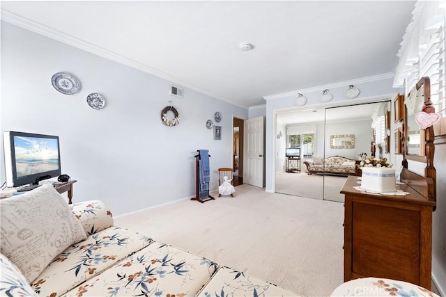 bedroom featuring carpet flooring, ornamental molding, and visible vents