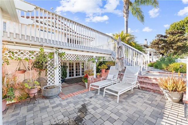 view of patio with stairs and french doors