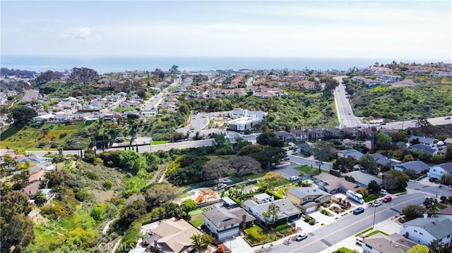 aerial view featuring a residential view and a water view