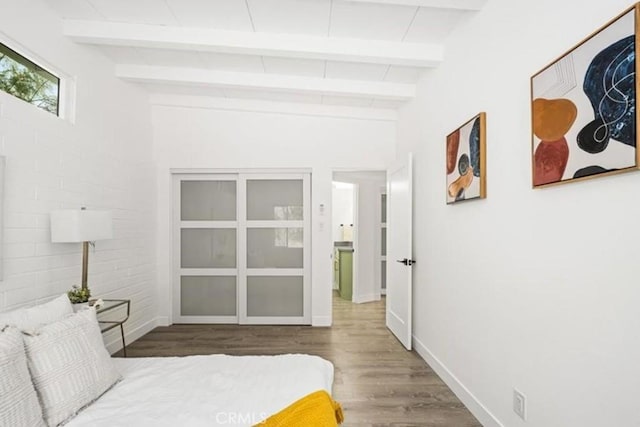 22495 Sierra Dr, Palm Springs, CA 92262 - bedroom featuring beamed ceiling, wood finished floors, and baseboards