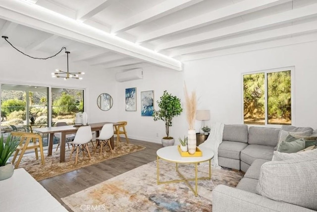22495 Sierra Dr, Palm Springs, CA 92262 - living room featuring an AC wall unit, beam ceiling, a chandelier, and a healthy amount of sunlight