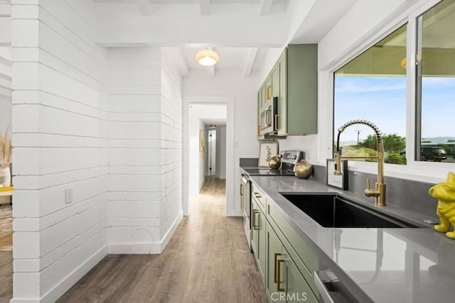 22495 Sierra Dr, Palm Springs, CA 92262 - kitchen with green cabinetry, a sink, appliances with stainless steel finishes, and wood finished floors