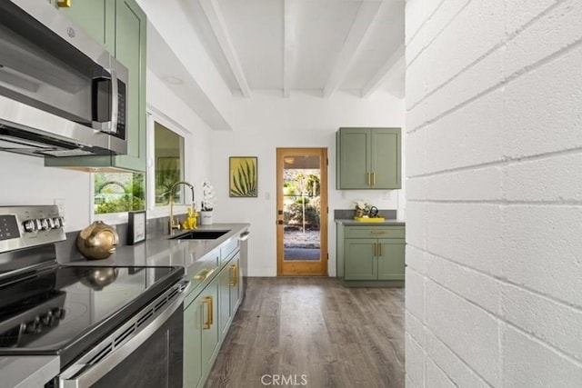 22495 Sierra Dr, Palm Springs, CA 92262 - kitchen with beamed ceiling, appliances with stainless steel finishes, green cabinets, dark wood-style flooring, and a sink