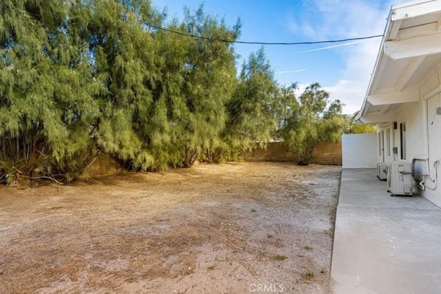 22495 Sierra Dr, Palm Springs, CA 92262 - view of yard featuring a patio area, ac unit, and fence
