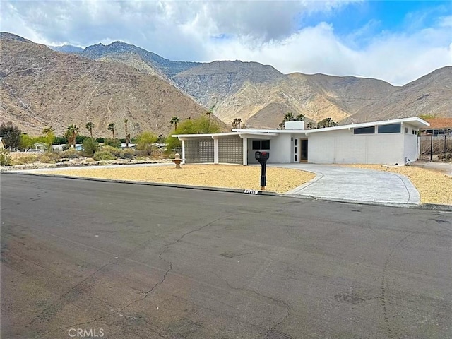 22495 Sierra Dr, Palm Springs, CA 92262 - view of front facade featuring driveway and a mountain view
