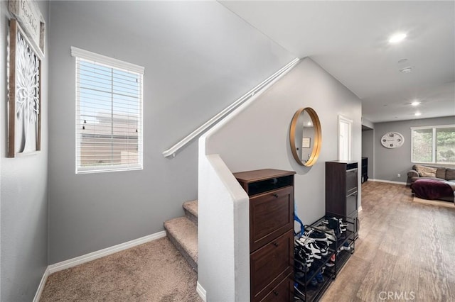 stairs featuring recessed lighting, baseboards, and wood finished floors