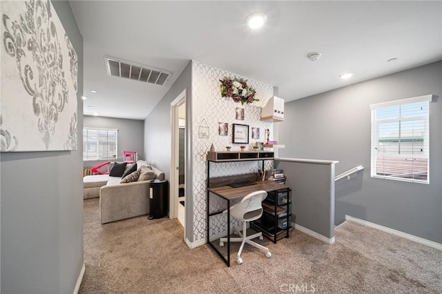 carpeted office with a wealth of natural light, recessed lighting, visible vents, and baseboards