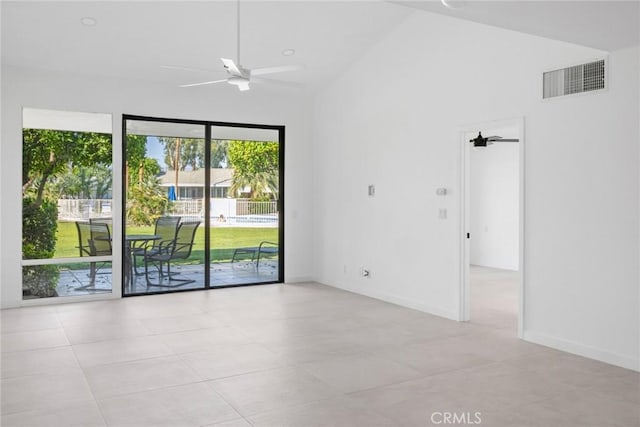 1910 Grand Bahama Dr E, Palm Springs, CA 92264 - spare room with ceiling fan, light tile patterned floors, lofted ceiling, and baseboards