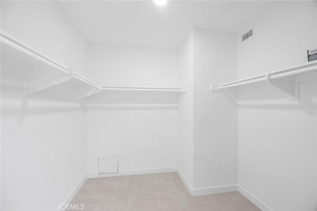 walk in closet with visible vents