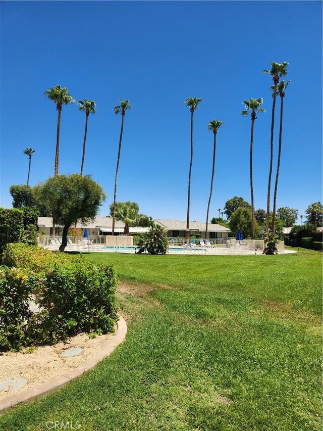 1910 Grand Bahama Dr E, Palm Springs, CA 92264 - surrounding community with a swimming pool
