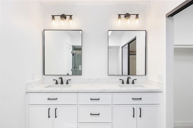 bathroom featuring a sink and double vanity