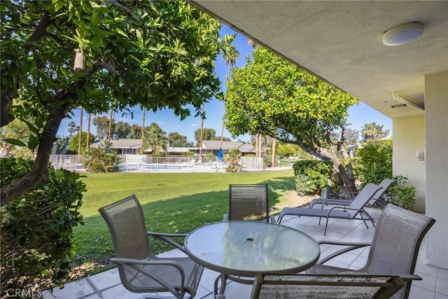 view of patio / terrace featuring outdoor dining area and fence