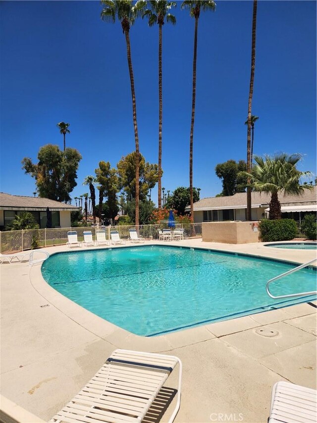 1910 Grand Bahama Dr E, Palm Springs, CA 92264 - community pool featuring fence and a patio