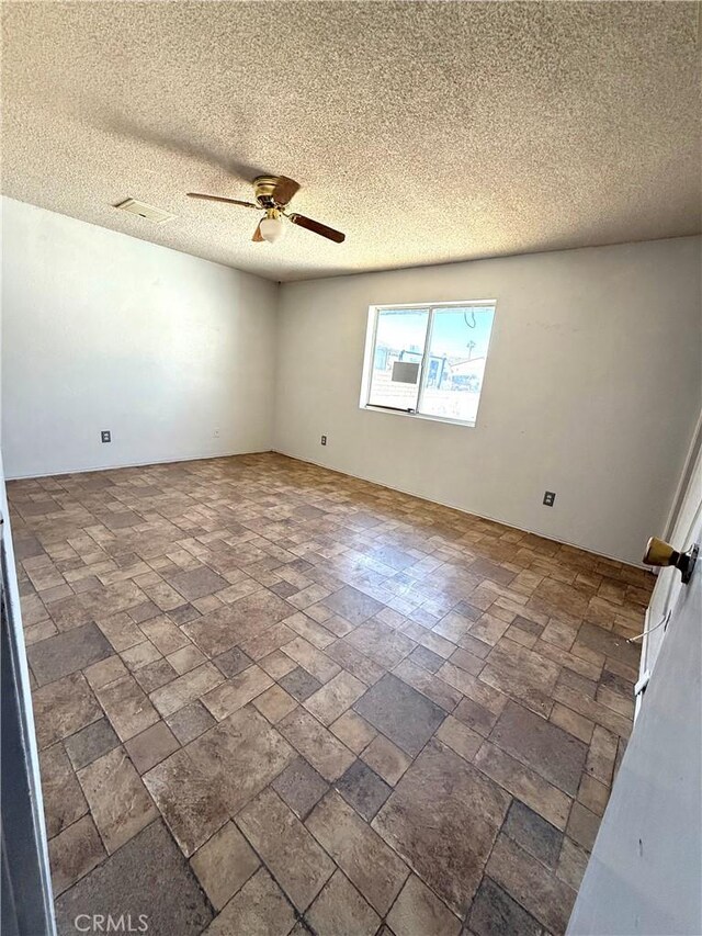 72183 Sunnyvale Dr Unit 29, Palms, CA 92277 - spare room featuring ceiling fan and a textured ceiling