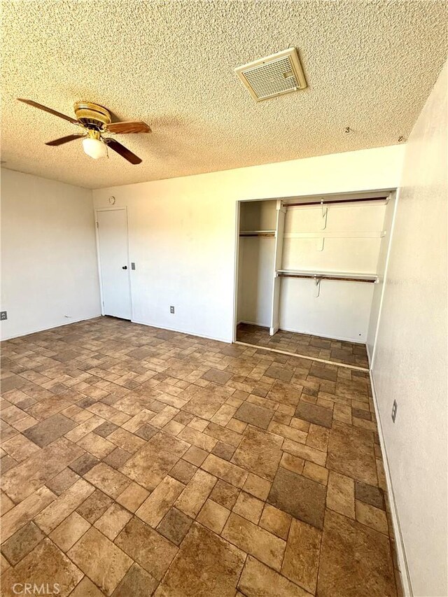 72183 Sunnyvale Dr Unit 29, Palms, CA 92277 - unfurnished bedroom featuring a textured ceiling and ceiling fan