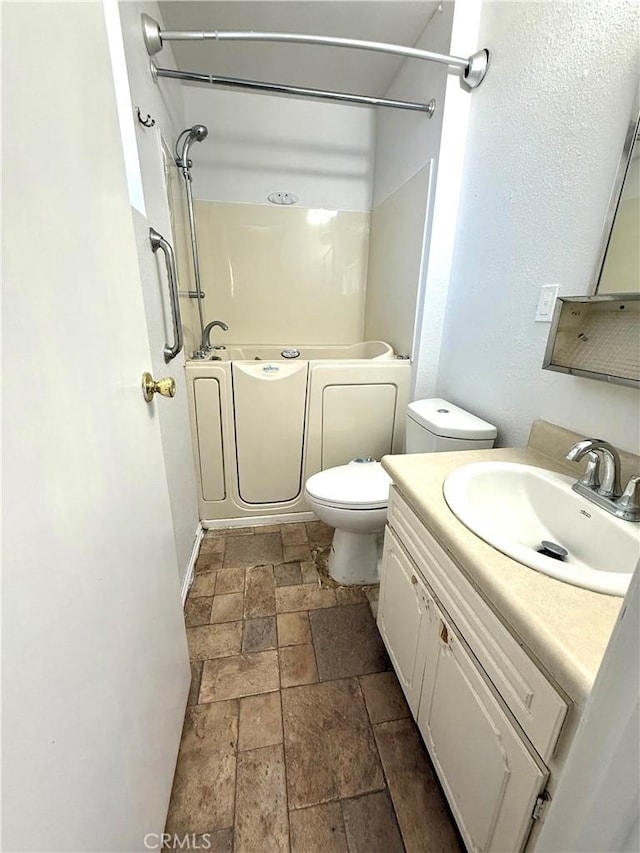 72183 Sunnyvale Dr Unit 29, Palms, CA 92277 - full bath with stone tile flooring, vanity, and toilet