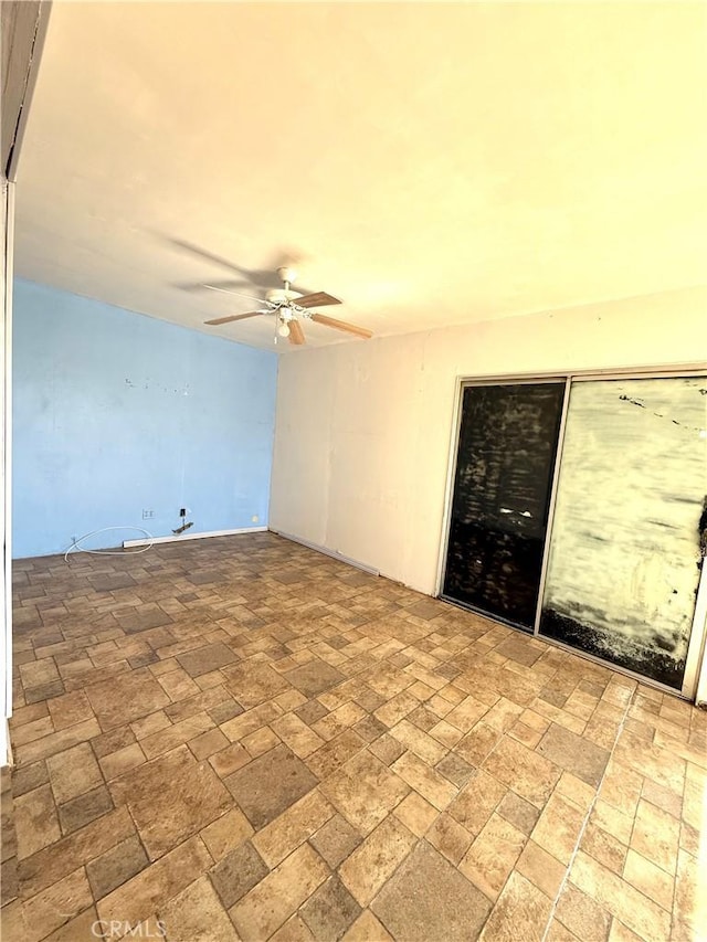 72183 Sunnyvale Dr Unit 29, Palms, CA 92277 - spare room with a ceiling fan and brick patterned flooring