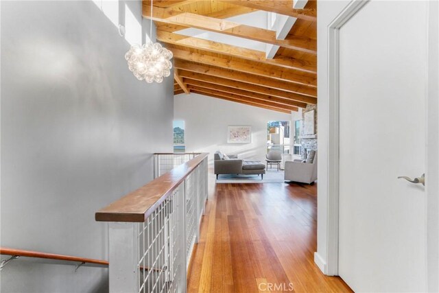 5084 Llano Dr, Woodland Hills, CA 91364 - hall with wood-type flooring, a skylight, a chandelier, and an upstairs landing