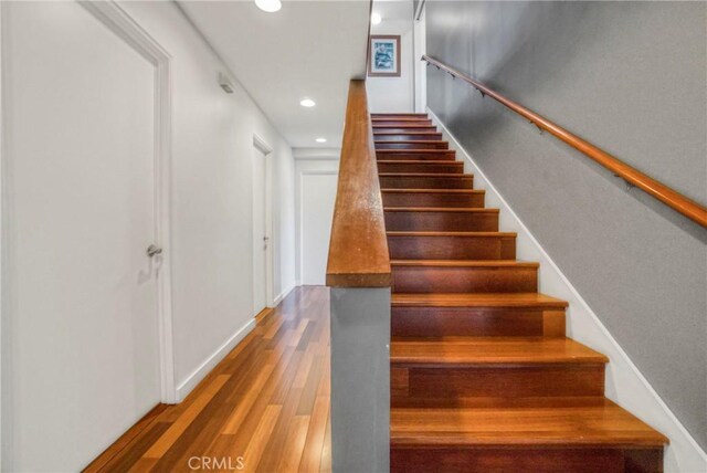 5084 Llano Dr, Woodland Hills, CA 91364 - stairway with wood finished floors, recessed lighting, and baseboards