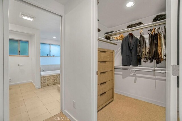 5084 Llano Dr, Woodland Hills, CA 91364 - walk in closet featuring tile patterned floors