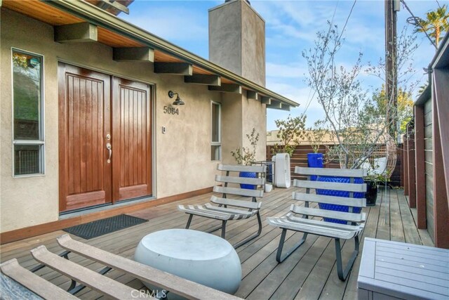 5084 Llano Dr, Woodland Hills, CA 91364 - deck with a fenced backyard and french doors