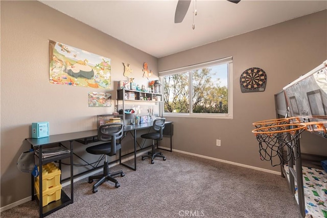 home office featuring baseboards, a ceiling fan, and carpet
