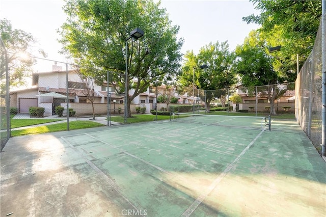 view of sport court with fence