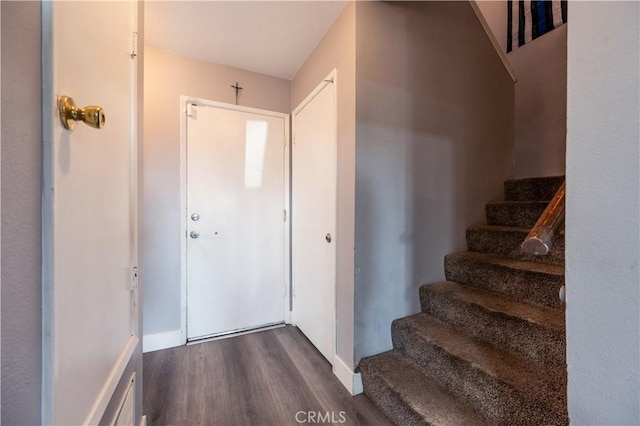 staircase featuring wood finished floors