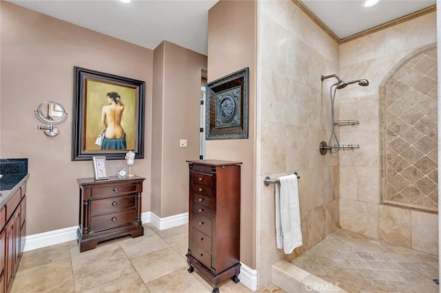 20711 Canyon Rd, Los Banos, CA 93635 - full bathroom featuring baseboards, vanity, tile patterned flooring, and tiled shower