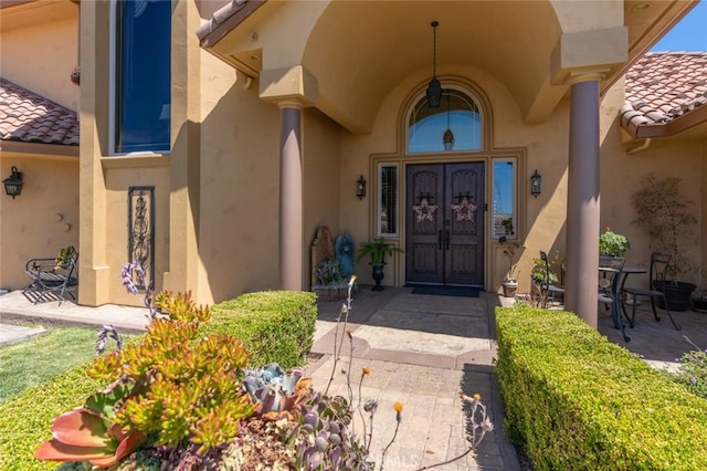 20711 Canyon Rd, Los Banos, CA 93635 - entrance to property with a tile roof, french doors, and stucco siding