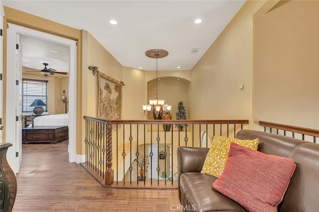 20711 Canyon Rd, Los Banos, CA 93635 - hallway with baseboards, wood finished floors, a chandelier, and recessed lighting