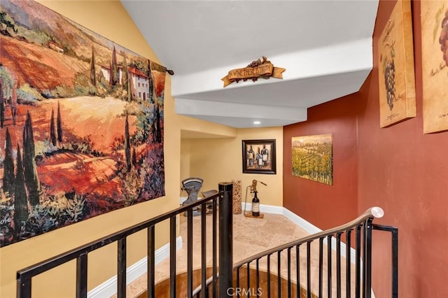 20711 Canyon Rd, Los Banos, CA 93635 - hallway with vaulted ceiling, baseboards, and an upstairs landing