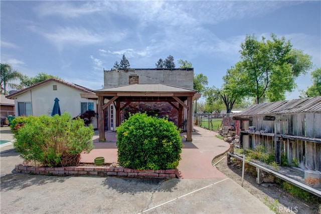view of community featuring a gazebo and fence