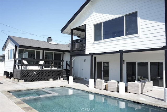 3130 E Craig Dr, Orange, CA 92869 - rear view of house with a balcony, a patio, and a pool with connected hot tub