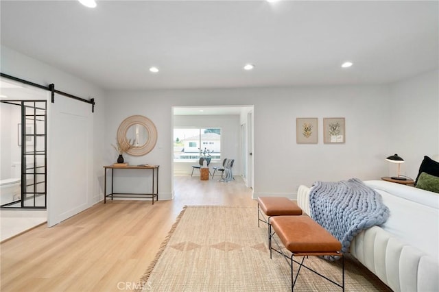 3130 E Craig Dr, Orange, CA 92869 - bedroom featuring wood finished floors, a barn door, recessed lighting, and baseboards