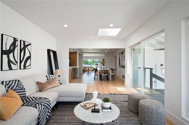 3130 E Craig Dr, Orange, CA 92869 - living room featuring wood finished floors, a skylight, and recessed lighting