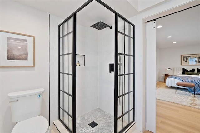 3130 E Craig Dr, Orange, CA 92869 - bathroom with connected bathroom, a tile shower, wood finished floors, toilet, and recessed lighting