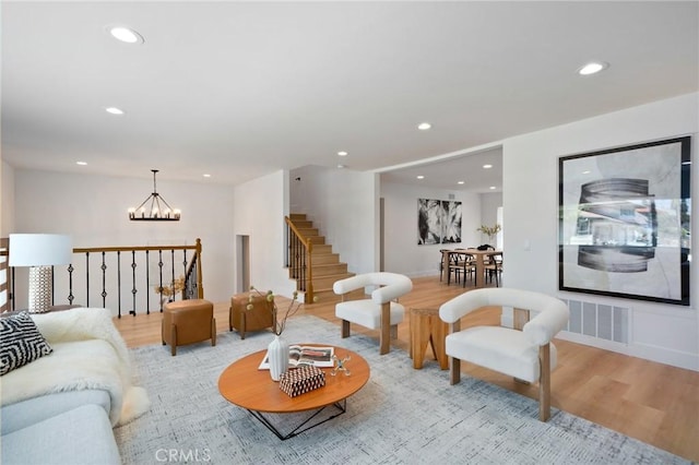 3130 E Craig Dr, Orange, CA 92869 - living area featuring a chandelier, wood finished floors, recessed lighting, and stairs