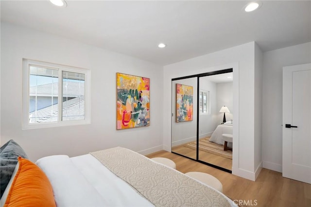 3130 E Craig Dr, Orange, CA 92869 - bedroom with light wood finished floors, baseboards, recessed lighting, and multiple windows