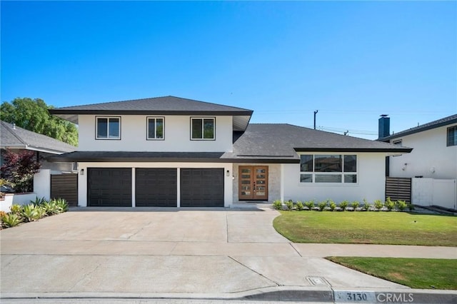 3130 E Craig Dr, Orange, CA 92869 - view of front of house with stucco siding, driveway, an attached garage, a front lawn, and a shingled roof
