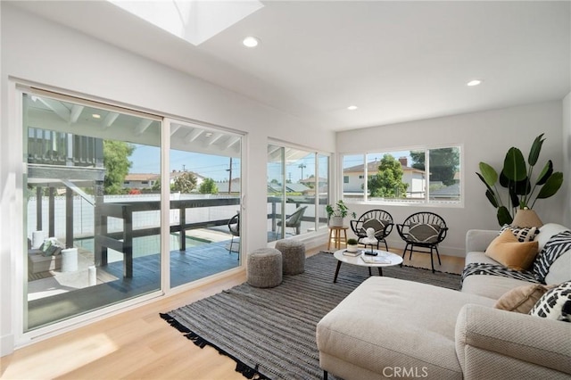 3130 E Craig Dr, Orange, CA 92869 - living room with wood finished floors, a skylight, recessed lighting, and baseboards